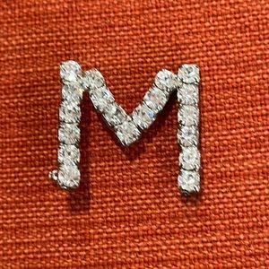 Silver rhinestone M pin